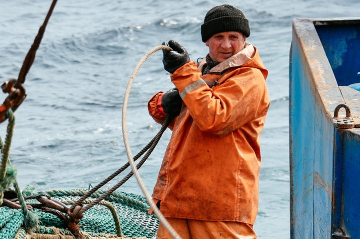 A fisherman pulling a rope.
