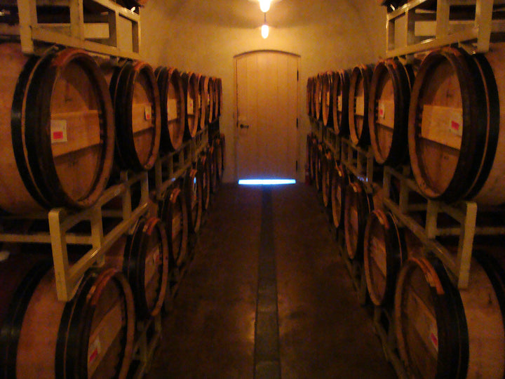 Brewery barrels lined up on two shelves