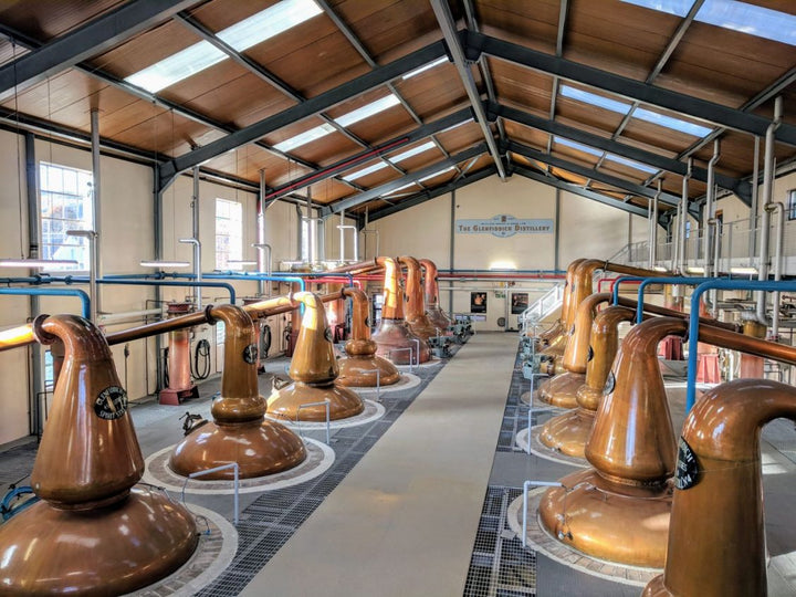 Distillery pumps in a barn area.